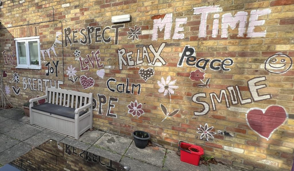 The mural in the courtyard garden at our Ware Crisis Cafe
